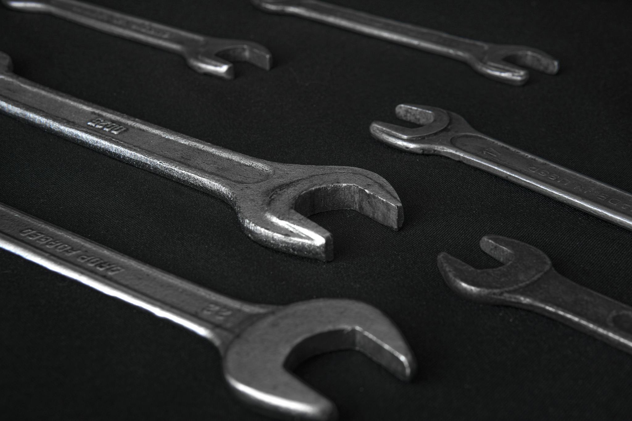 High-quality image showcasing various wrenches on a dark background, perfect for industrial themes.