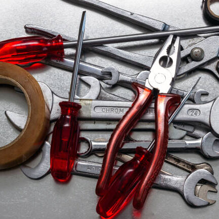 Wrenches and screwdrivers, pliers, electrical tape.