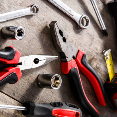 Building tools repair set on wooden background