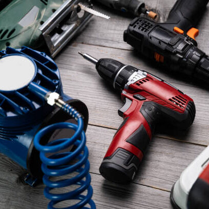 Electric hand power tools in repair workshop