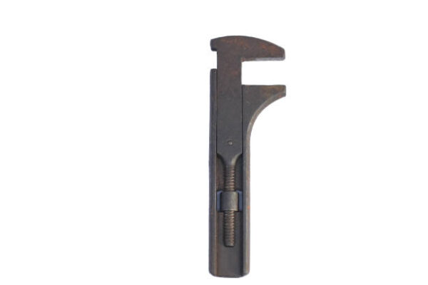 Full rusty adjustable monkey wrench cap isolated white background