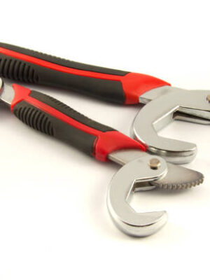 The steel spanner place on the white background