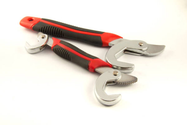 The steel spanner place on the white background
